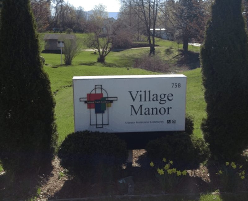 Village Manor sign