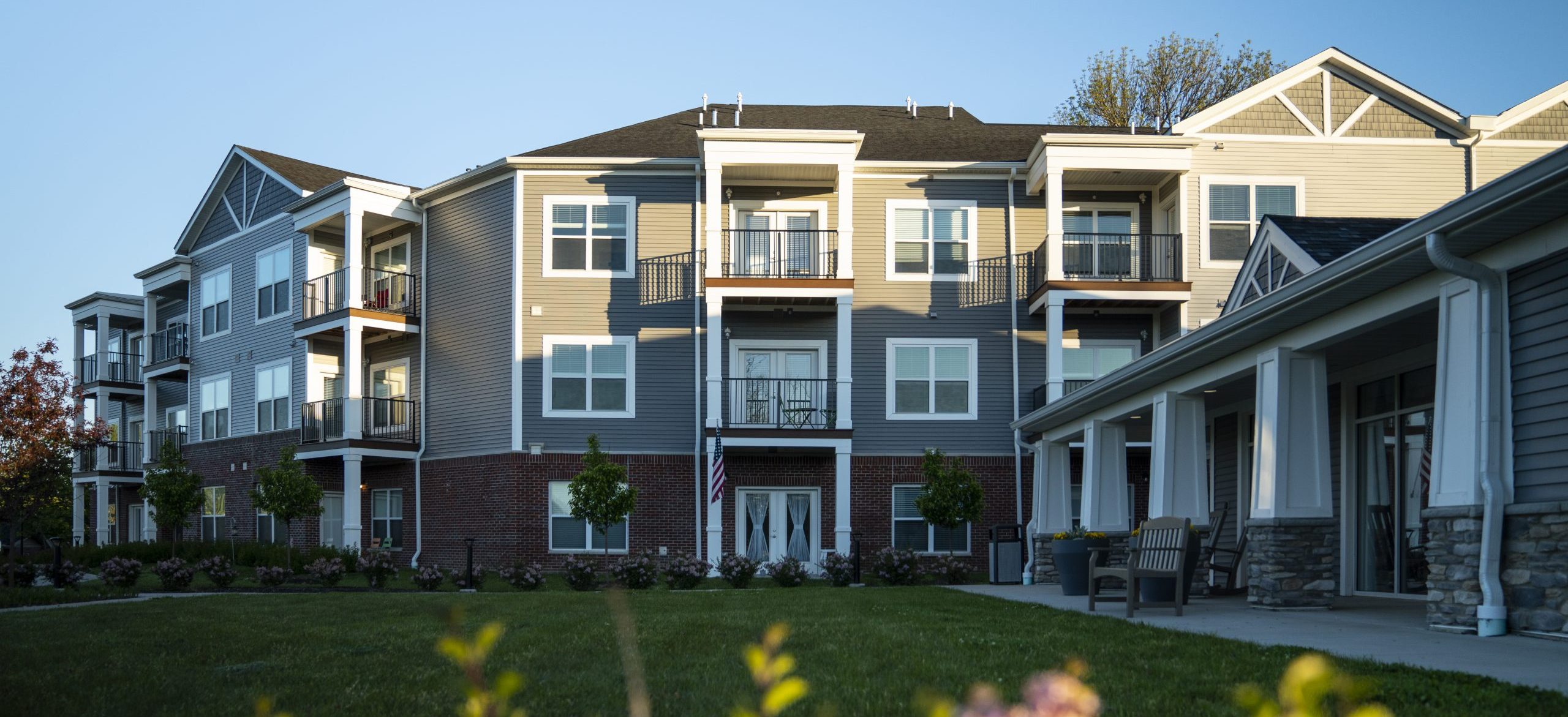 Exterior photo of Legacy Village apartments as the sun rises