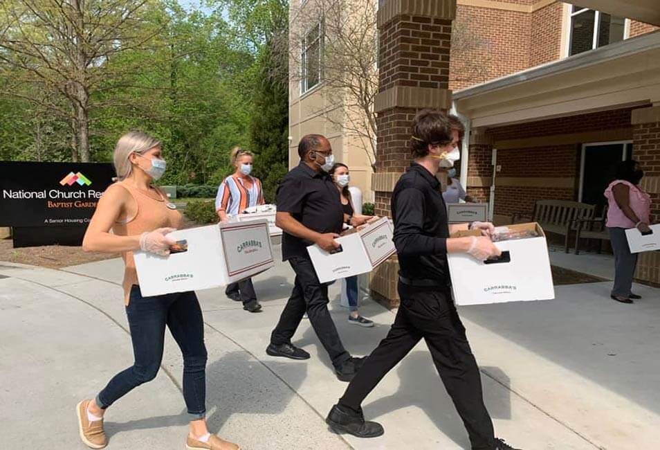 Carrabba's employees delivering food.