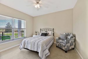 A bedroom in a independent living apartment at Legacy Village