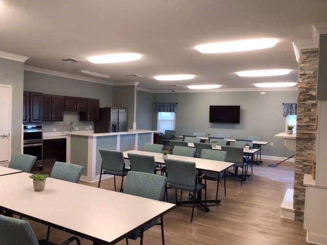 Common area with kitchen at Mid-Tule Village