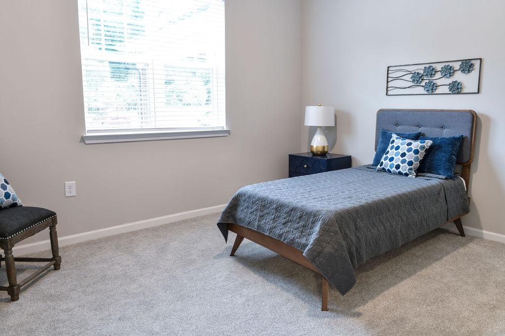 A bedroom inside of a True Light Haven apartment