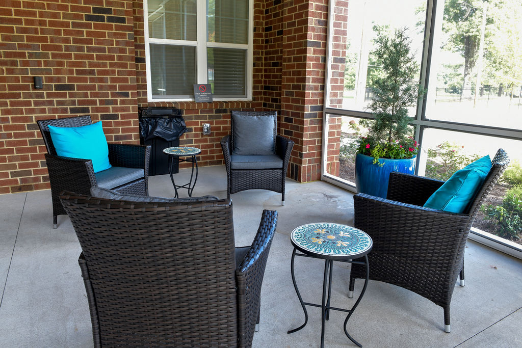 Well lit enclosed patio with new patio furniture