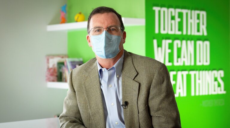 photo of president and CEO Mark Ricketts wearing a mask