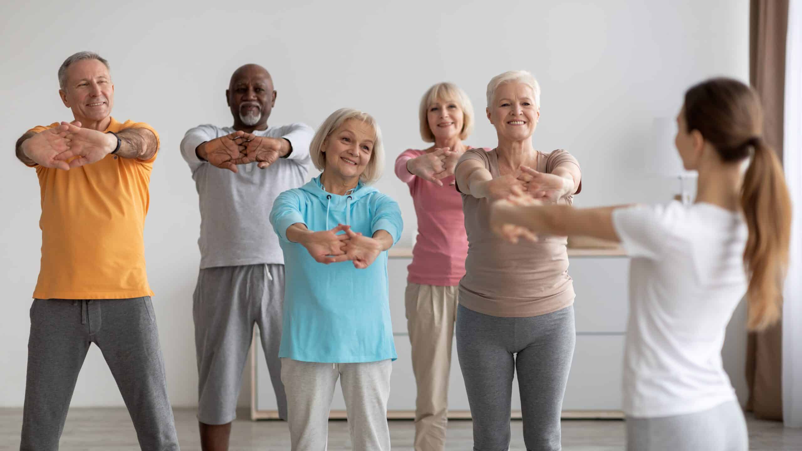 A group of happy and healthy people making the most out of workouts for seniors.