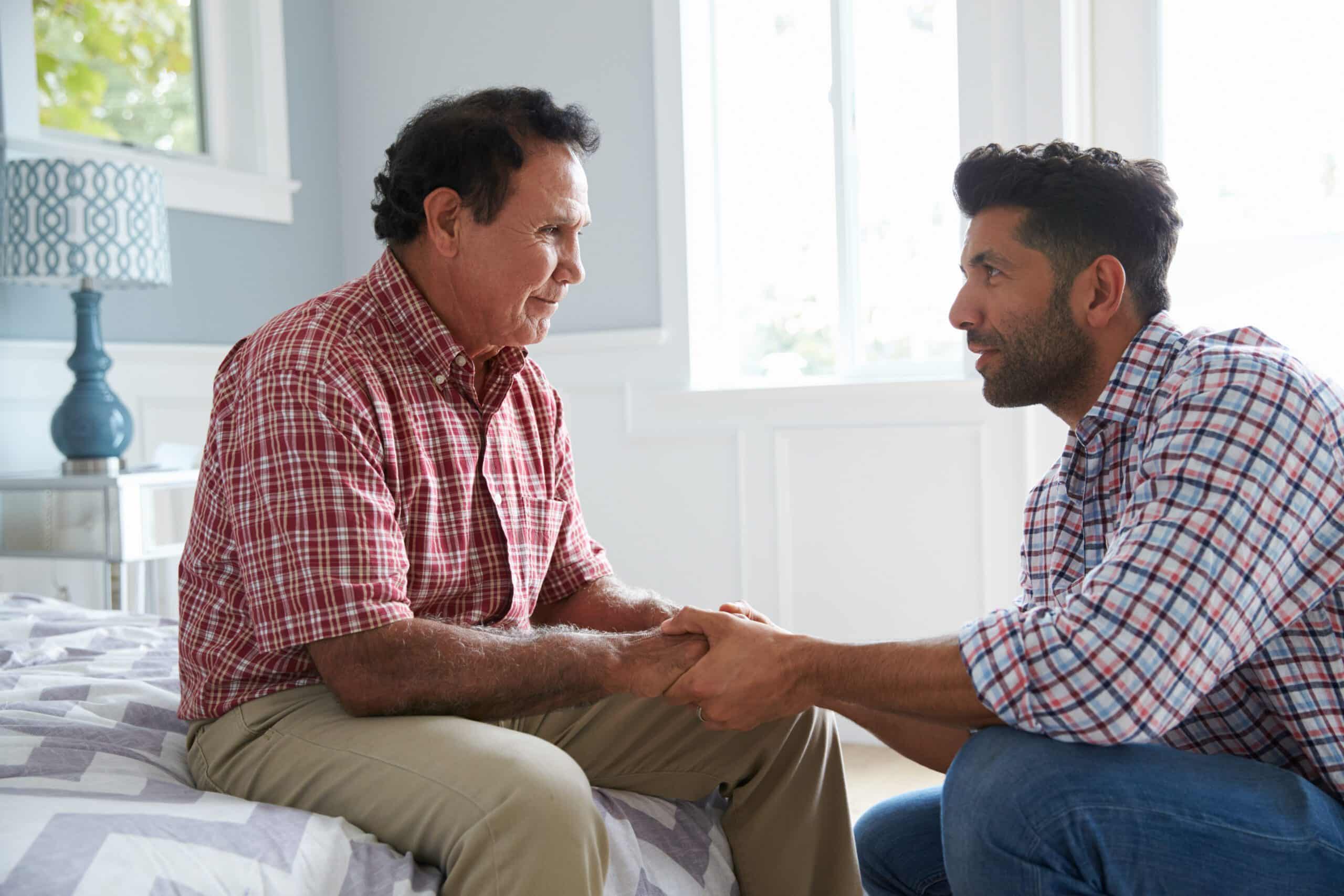 A son helping his father transition from assisted living to memory care.