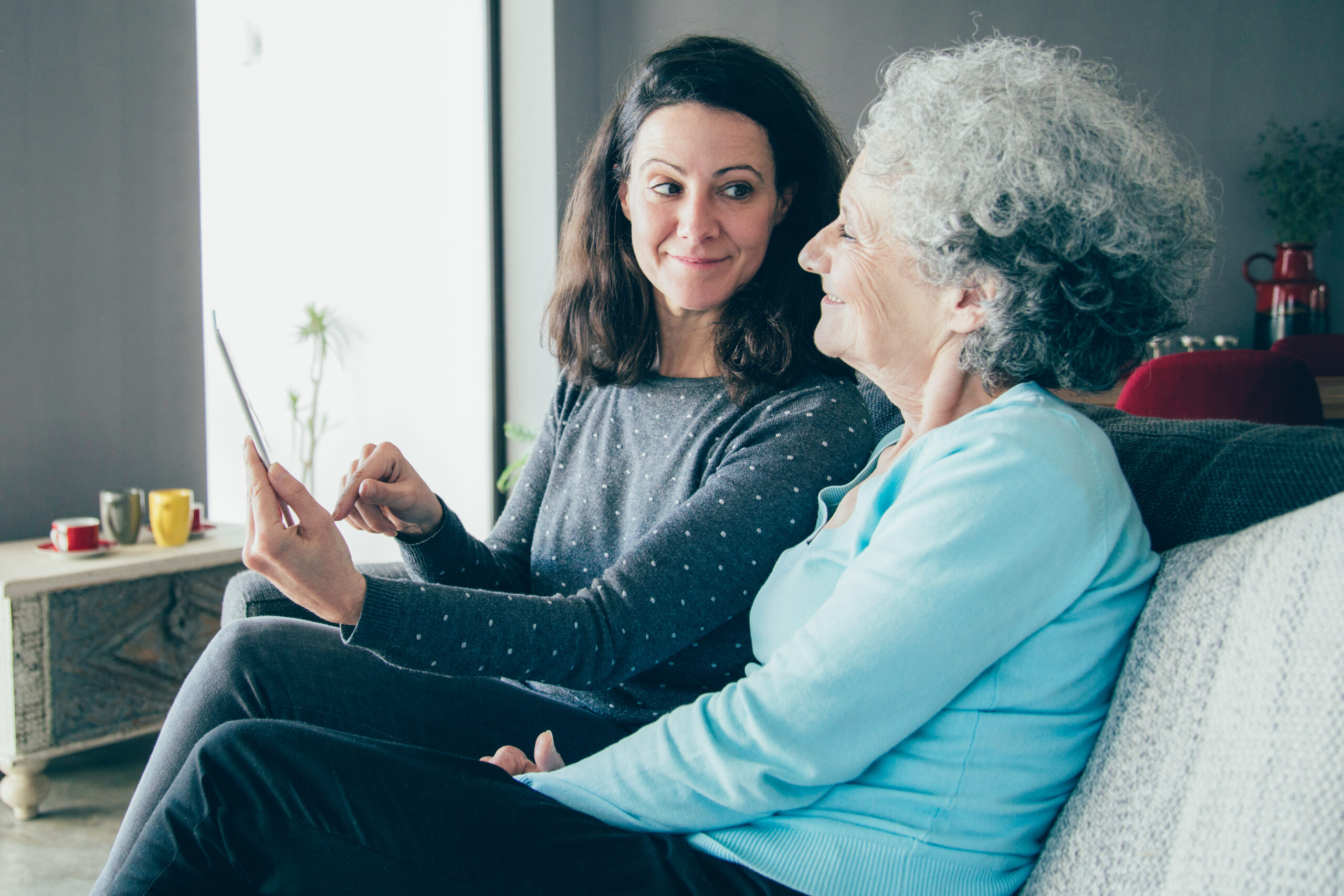 A caregiver talking to an elderly parent who refused help.