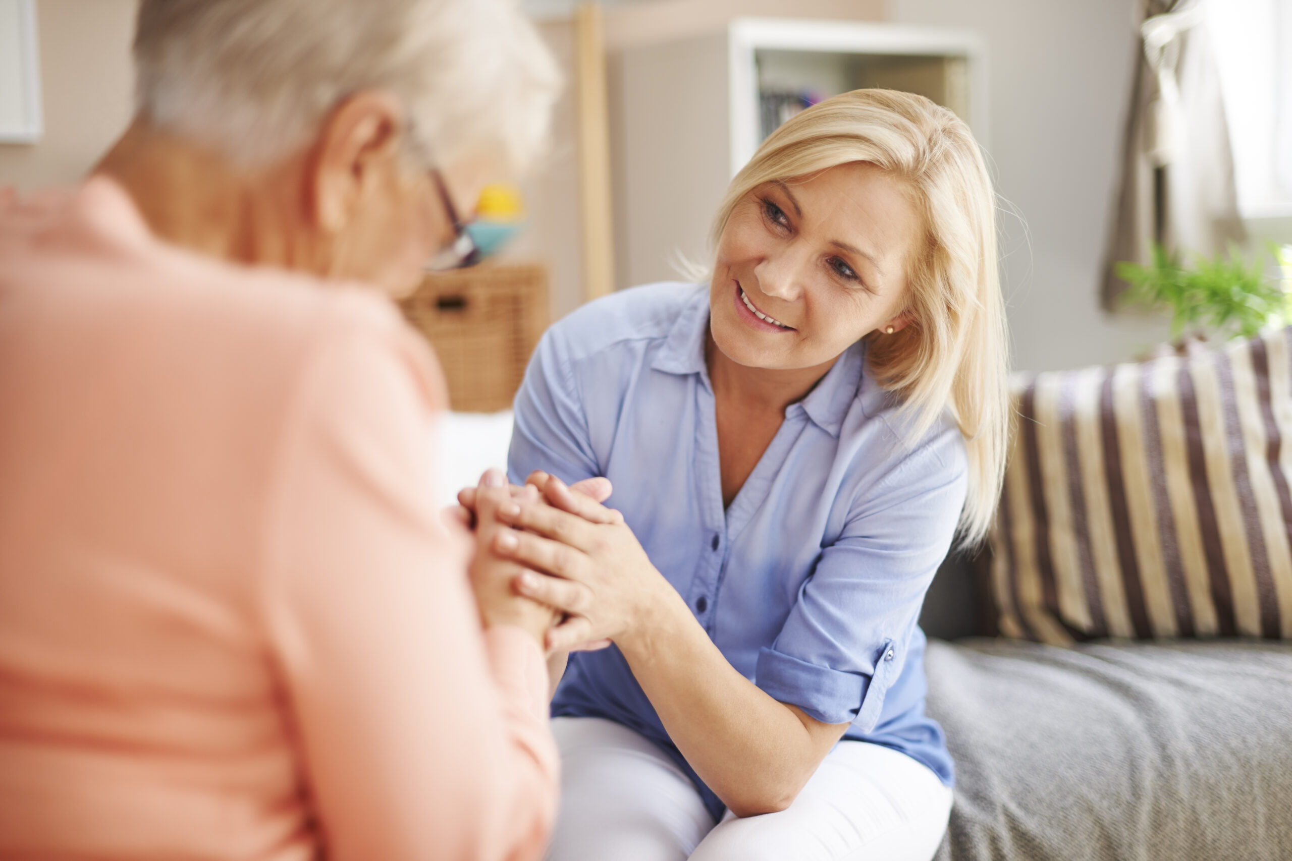 A caregiver with her mother after moving into independent living for adults.