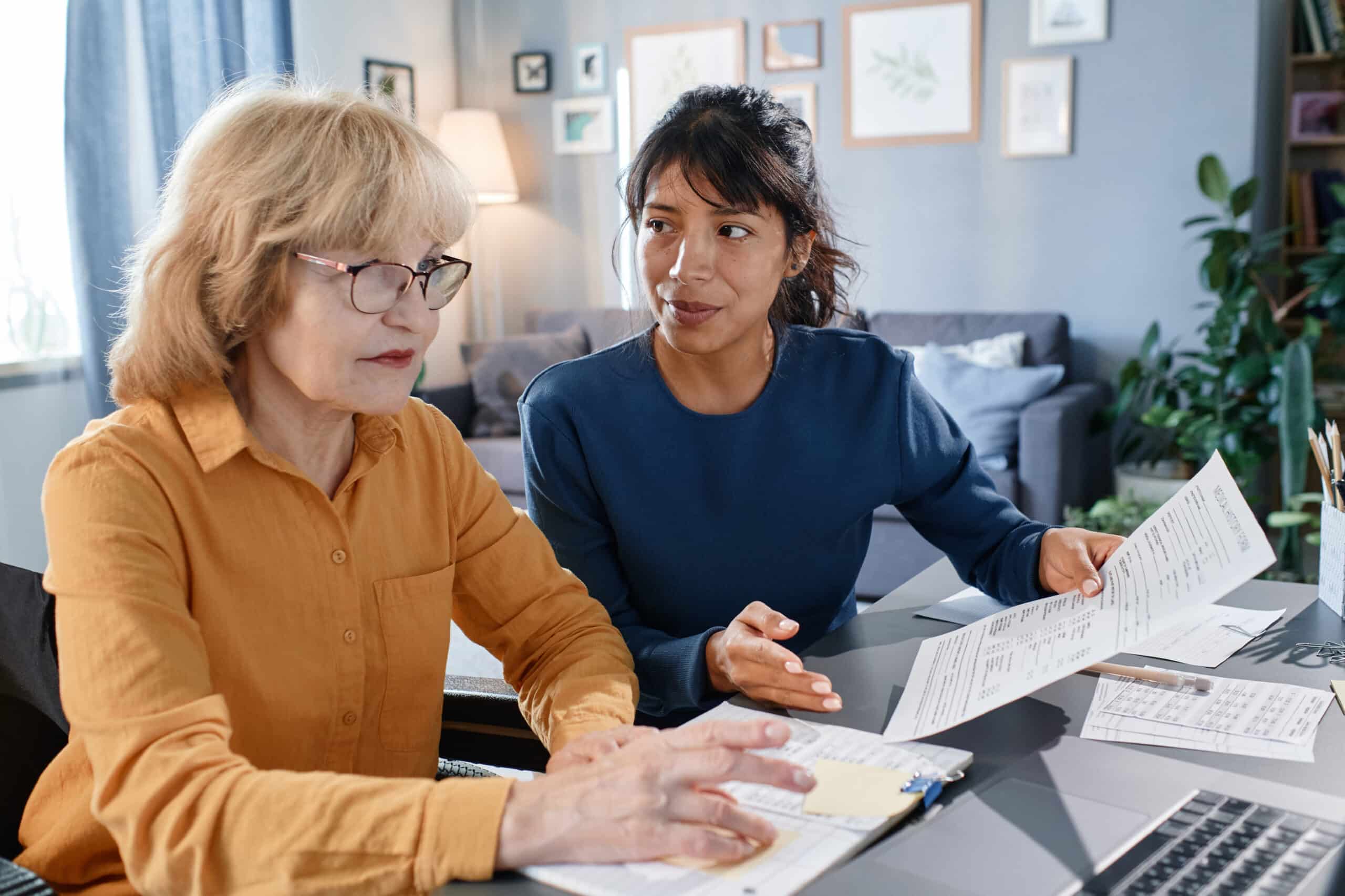 Mother and daughter learning about tax deductions for caregivers.