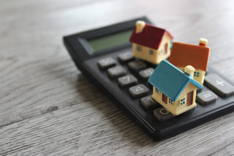 Small models of LIHTC income-restricted housing on a calculator.