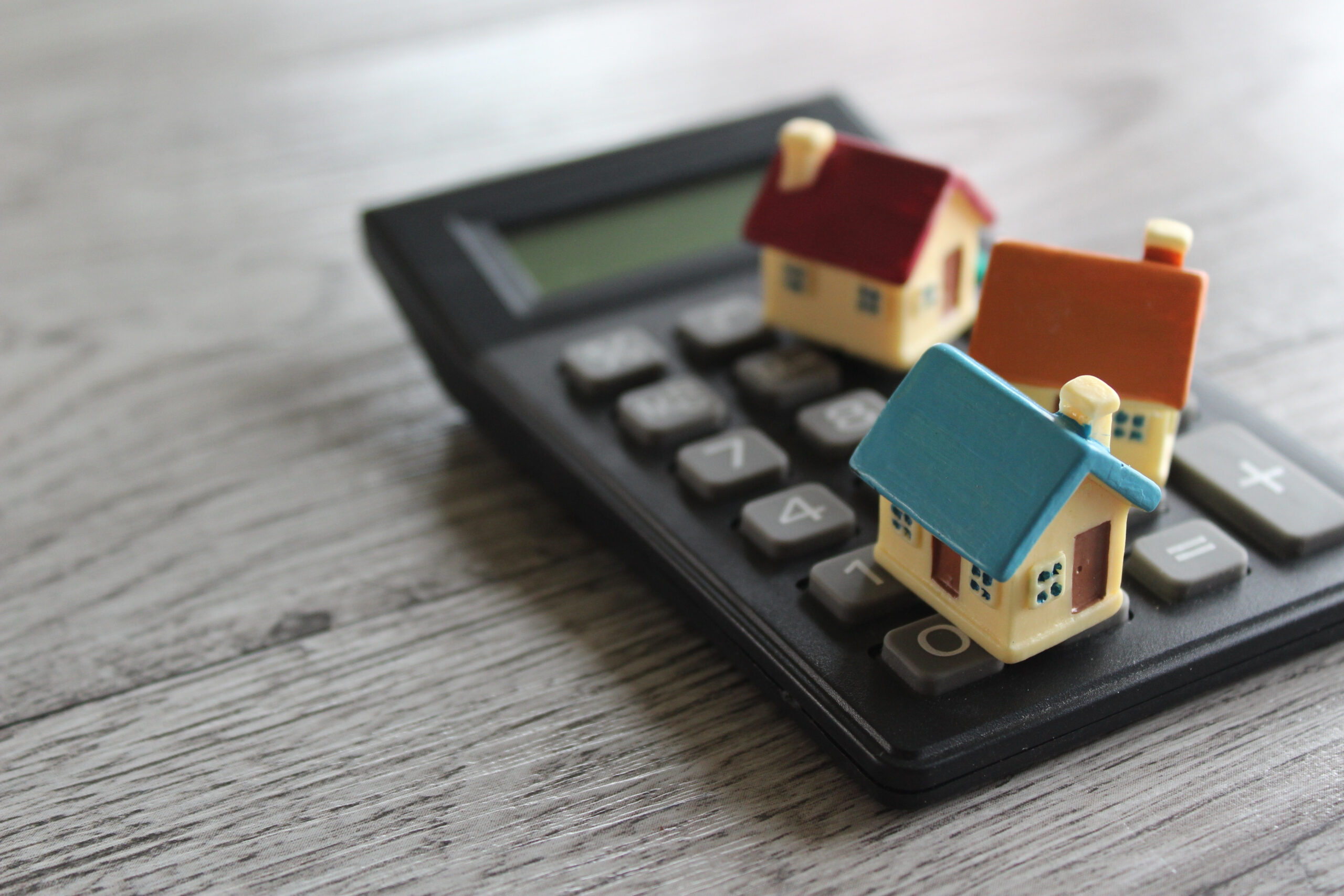 Small models of LIHTC income-restricted housing on a calculator.