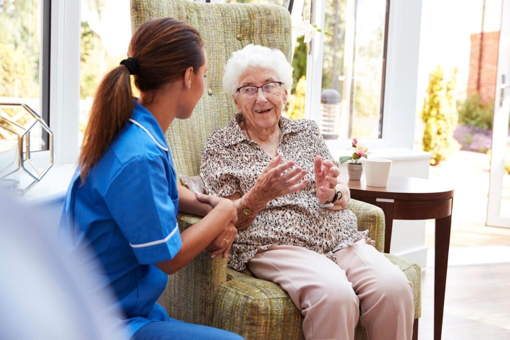 Elderly woman with nurse