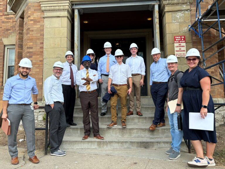 Team at construction site wearing helmets