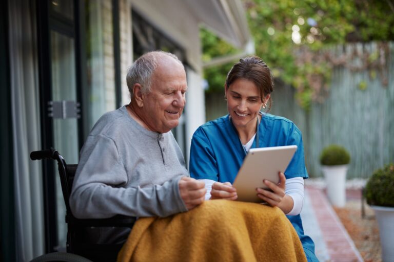 A senior man being cared for by a hospice caregiver.