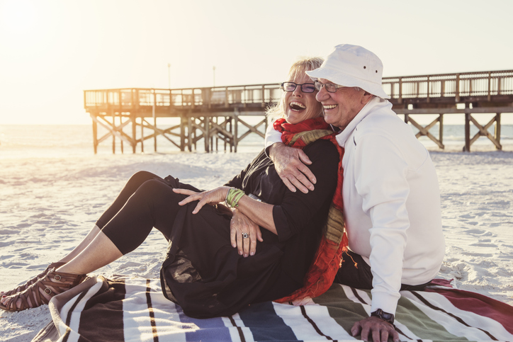 Senior couple hugging on beach