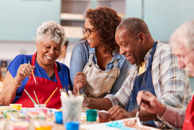 Group of seniors in an art class painting