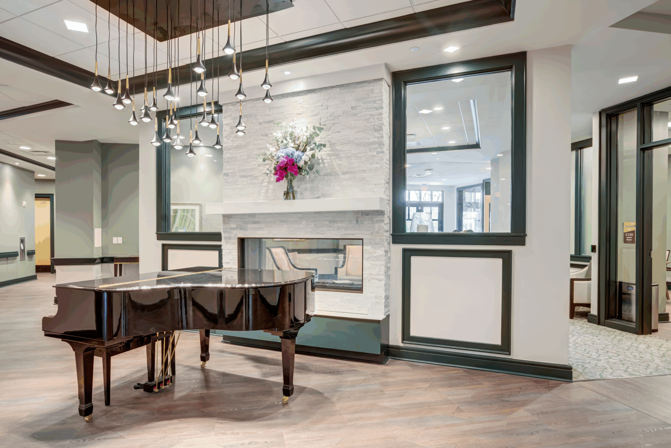 Interior image of Brookwood Point's lobby with piano