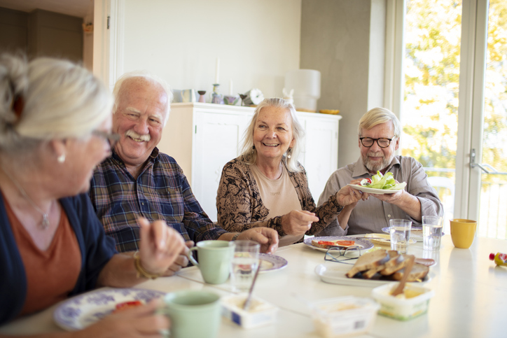 Close up of a small group of seniors having breakfast together