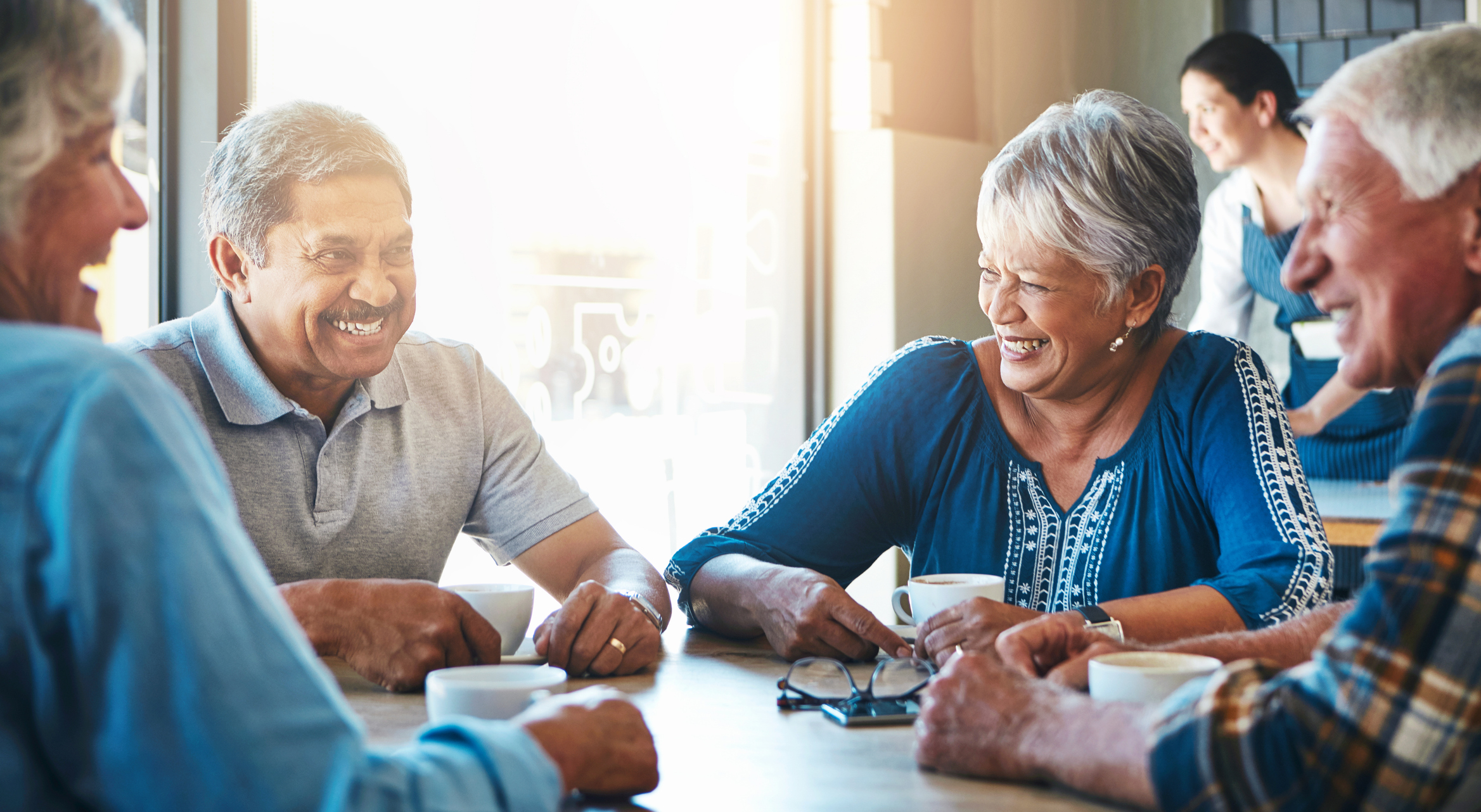 Seniors talking at a table