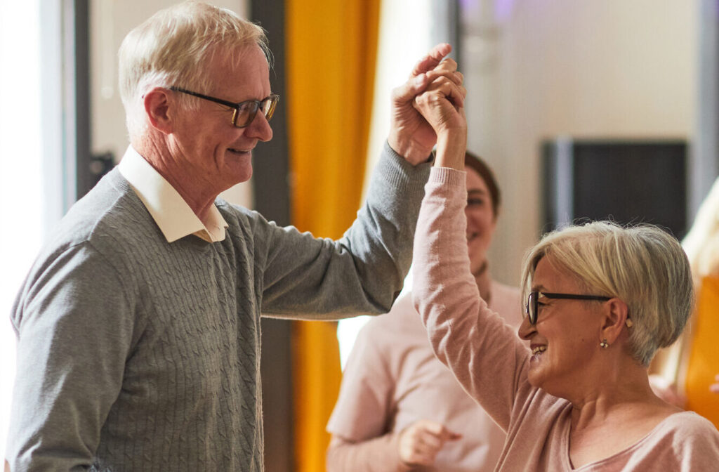 Senior couple dancing at a social event at Brookwood Point