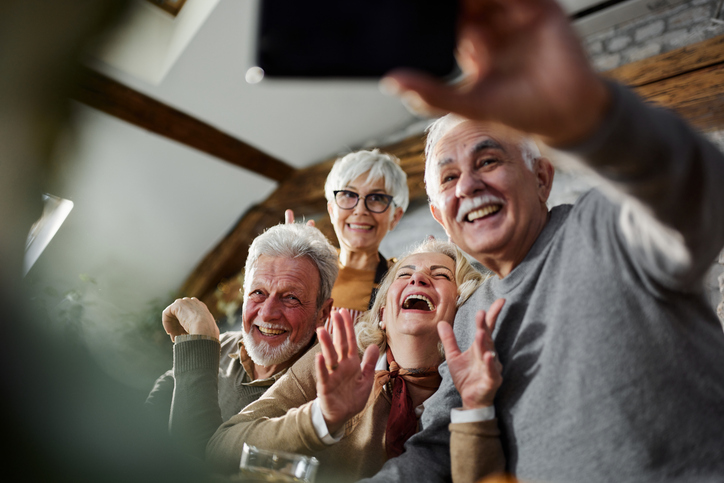 Group of happy seniors taking a selfie