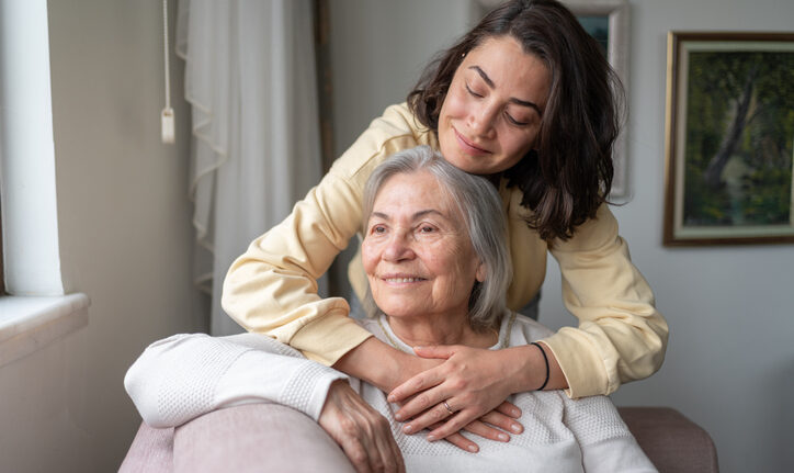 Daughter Hugging Senior Mother For Love Bonding Together