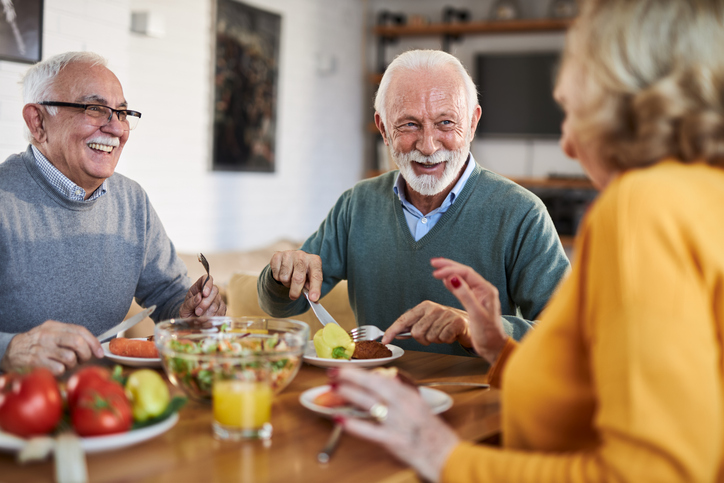 Seniors socializing at dinner