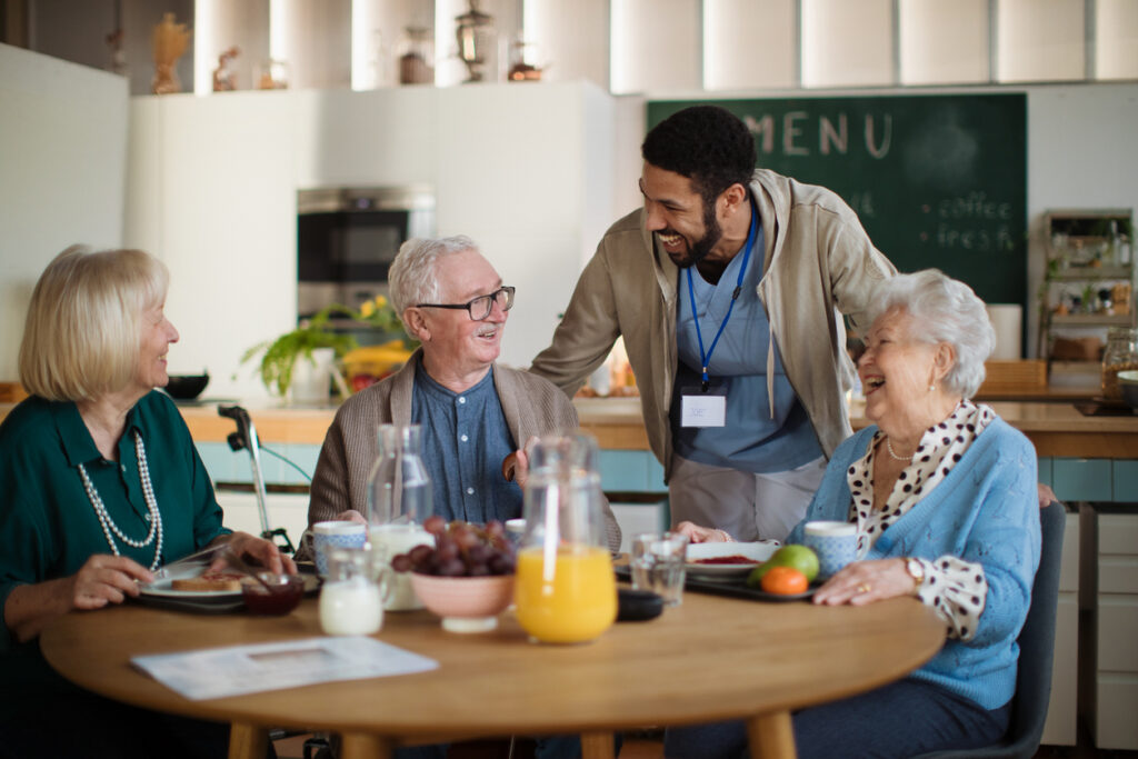 Older adults enjoying meal in the dining room