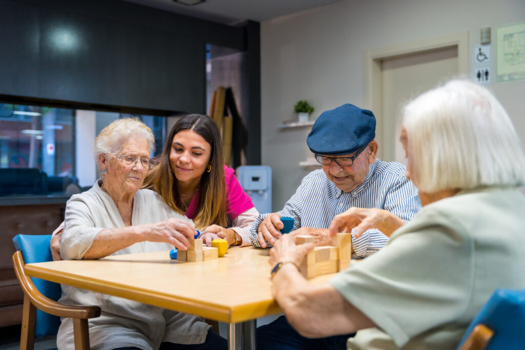 Seniors and staff playing games at Brookwood Point