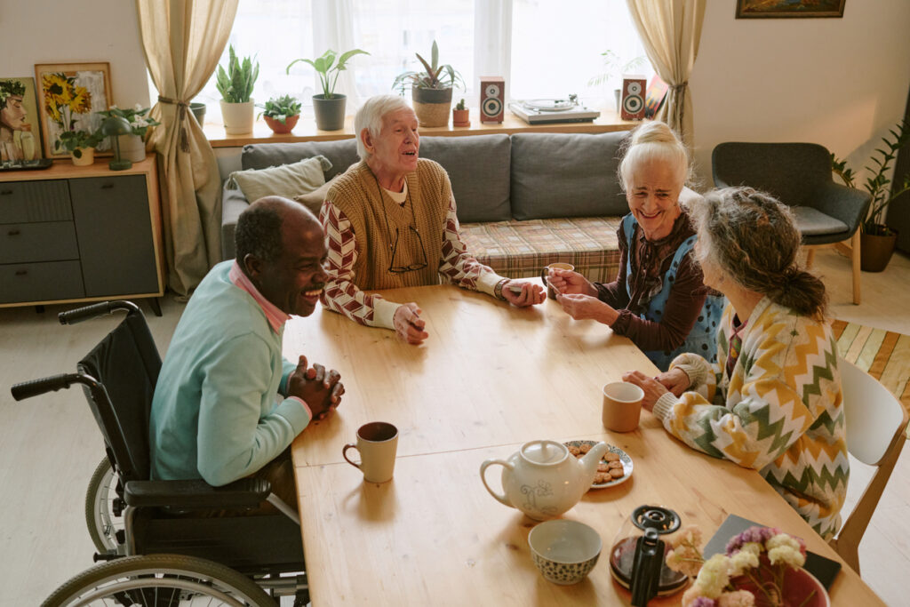 Seniors enjoying tea and conversation at Brookwood Point