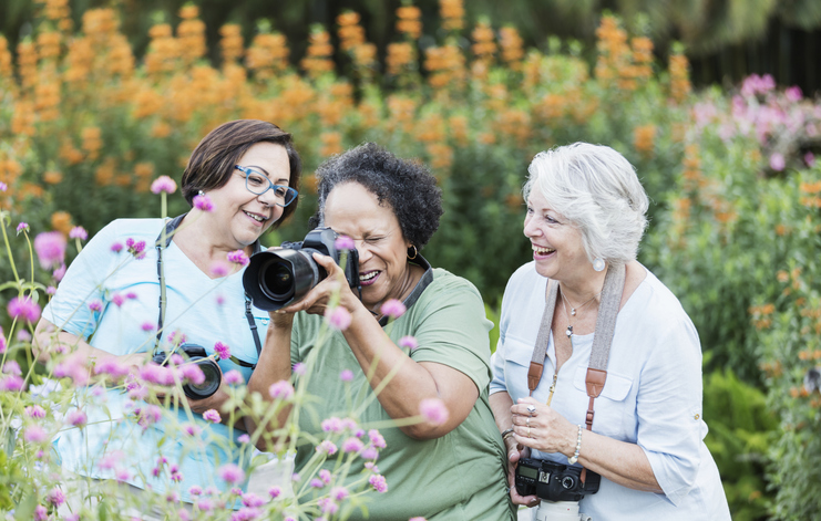 Seniors taking pictures of flowers