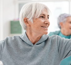 Group of seniors practicing yoga inside