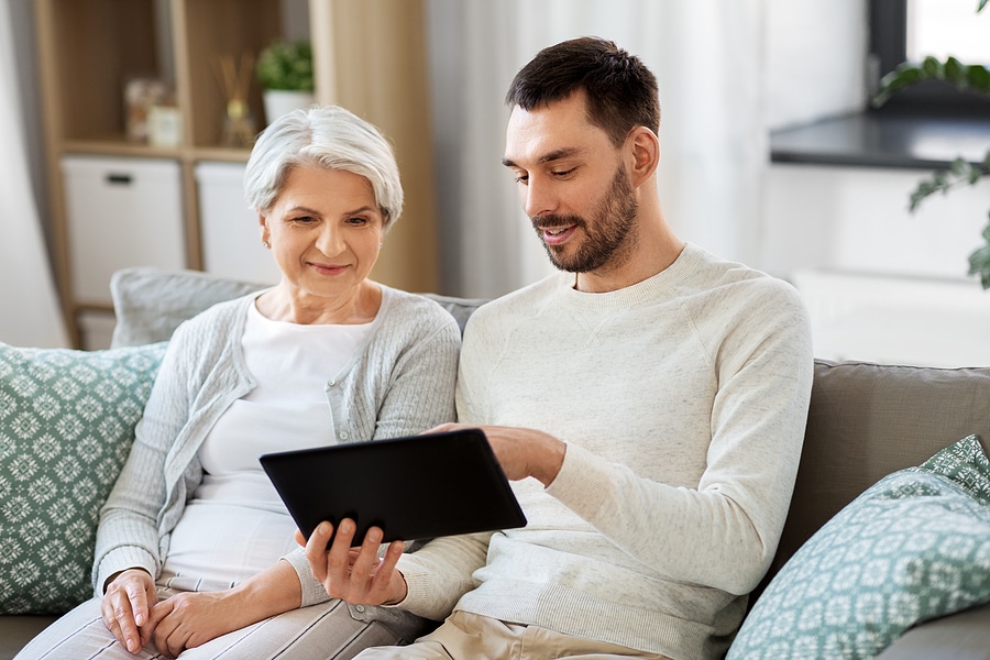 Adult son discusses options for moving to senior living with mother