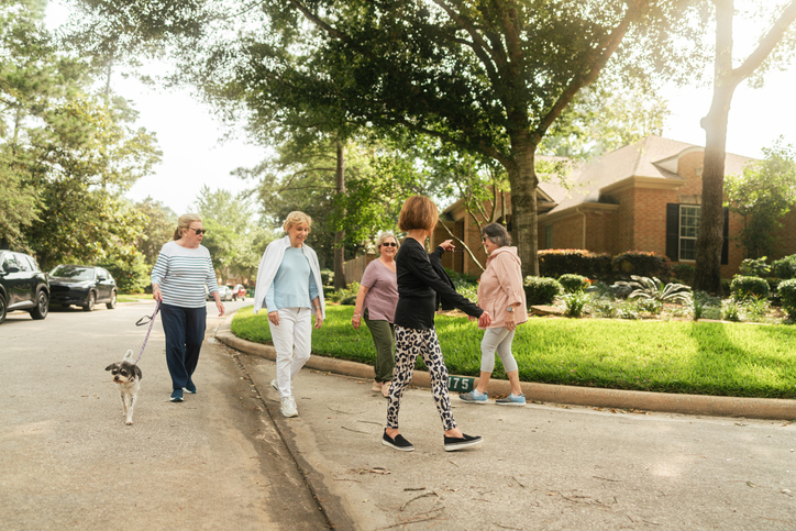 A group of five senior women on a walk together.