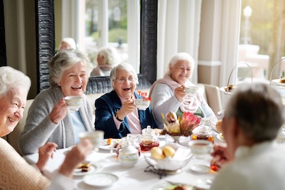 Group of senior women enjoying tea time together