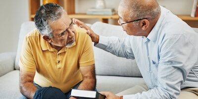 Men, home and bible with support for faith, worship and prayer by pastor, church or jesus christ. Elderly men, diversity and spiritual guidance for grief with loss and depression with hope in god
