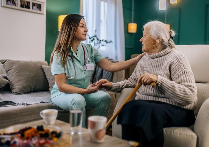 Senior thanking caregiver