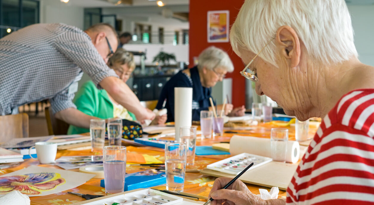 Seniors painting and doing crafts