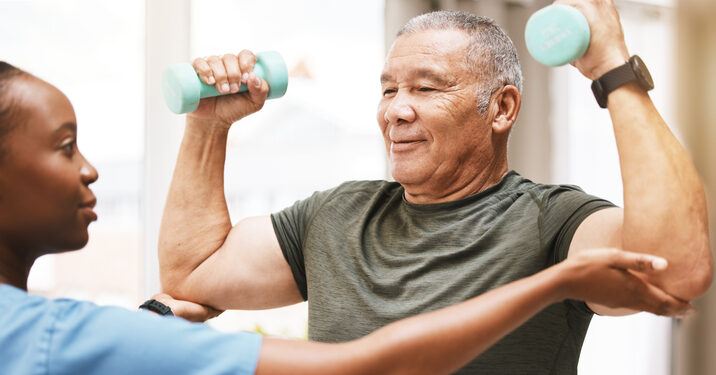 Senior woman smiling while holding a cup of coffee
