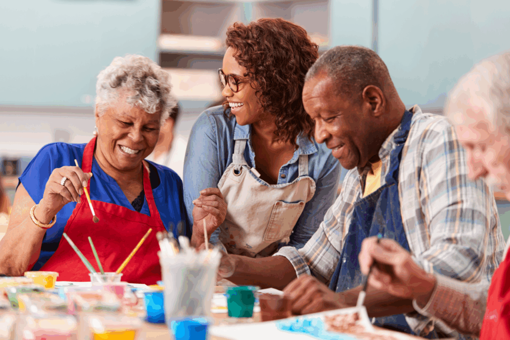Seniors enjoying group painting activity